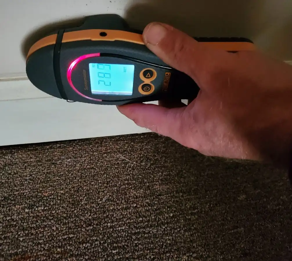 Moisture detection at baseboard during Sewage Cleanup & Sanitation in Delran